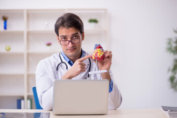 Young male doctor cardiologist working at the hospital