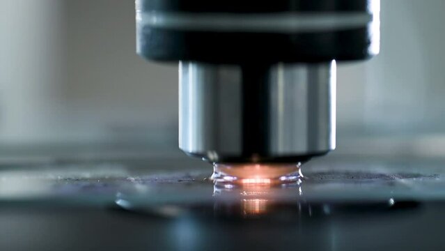Close up Microscope lens change Magnification of lens for zoom enlarge bacteria or microorganism on slide. Electronic microscope examining a drop of liquid on sample slide by Scientist industrial lab.
