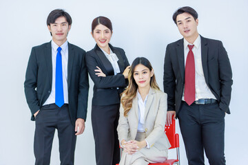 Portrait studio shot of Millennial Asian young professional successful male female businessmen businesswomen management group in formal suit sitting standing posing together on white background
