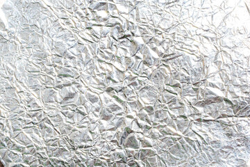 crumpled silver foil paper texture abstract background