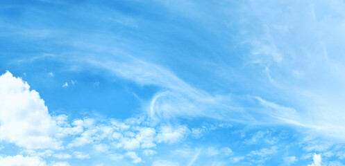 Light blue sky and white clouds.
(panorama)
With copy space.