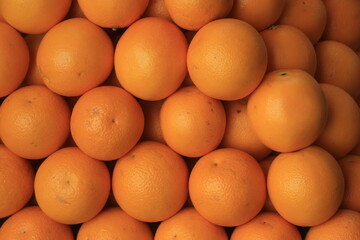 Closeup of fresh yellow orange in a market