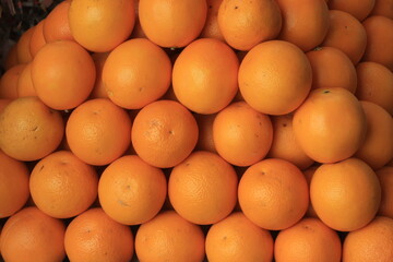 Closeup of fresh yellow orange in a market