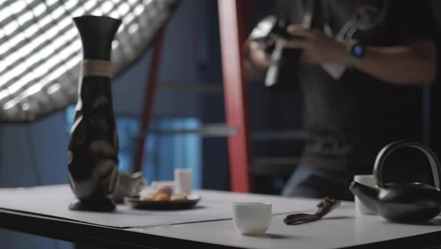 Shooting food and drink product advertisements in a photography studio with lighting equipment.