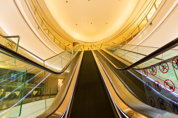 Escalator in the building of the business center, Straight stairs in the mall