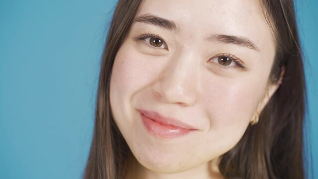 Close-up portrait of beautiful asian young woman with happy and smooth face.
Close-up portrait of attractive beautiful asian young woman. Smile and smile.
