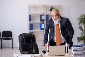 Old male employee after accident at workplace