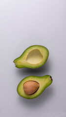avocado cut in half isolated white
