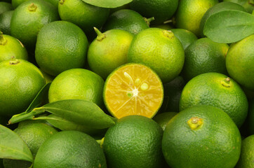 Many fresh green limes close up