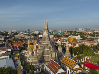 An aerial view of the Pagoda stands prominently at Wat Arun Temple with Chao Phraya River, The most famous tourist attraction in Bangkok, Thailand.