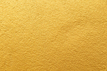 Golden color with an old grunge wall concrete texture as a background.