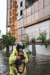 Semarang, December 2022. Some people are walking through the flood that hit the Poncol train...