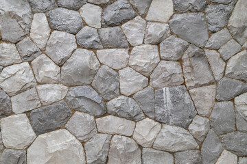 Full frame shot of marble rock wall texture as background.