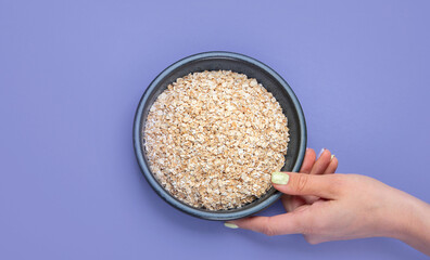 Oatmeal on color background