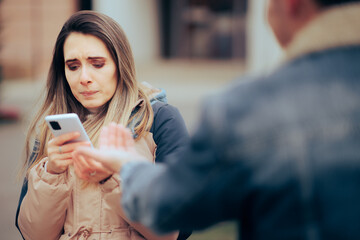 Jealous Woman Checking the Phone of Her Boyfriend Invading Privacy. Unfaithful husband caught...