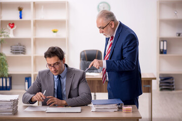 Two male colleagues sitting in the office