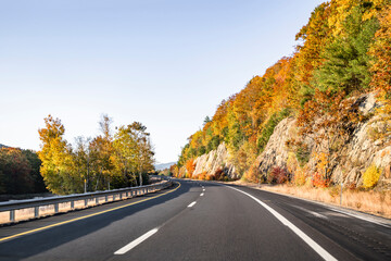 The scenic road invites travelers and tourists to enjoy the beauty of autumn maples in the rocky...