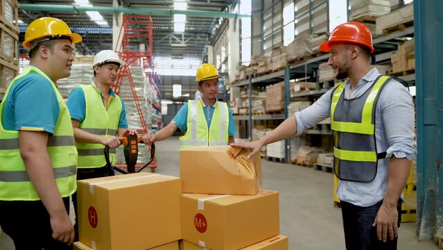 4K, group warehouse workers about transport goods cargo point, But his supervisor came across damaged box, his boss reminded him with polite word, so as not deliver damaged goods customers.