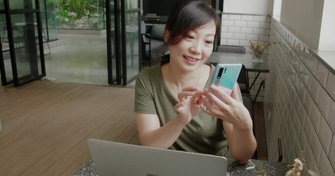 young woman working on mobile phone