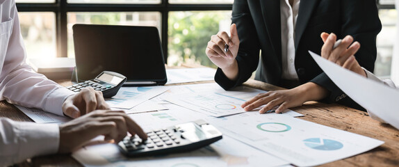 Accounting fund managers meeting to planning to improve quality next year team consultation investment stock market analysis and checking document.