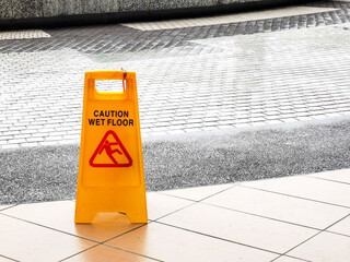 wet floor caution sign at the buiding enterance.