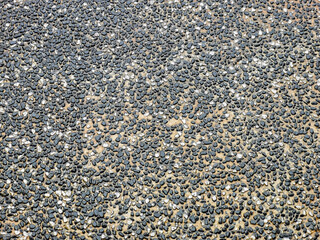 Top view rough surface of small pebble stone floor. Selective focus.