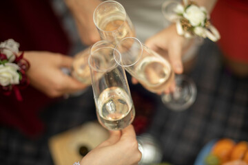 Glasses with champagne in hand. Wine by glass.