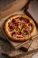 pizza from a cardboard box for delivery