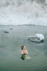 Woman relax in warm springs water