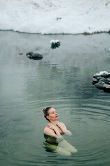 Woman relax in warm springs water