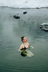 Woman relax in warm springs water