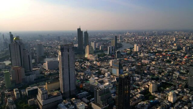 Skyscrapers in Bangkok Thailand. River, Silom area, business district, downtown. Drone shot sunny day.