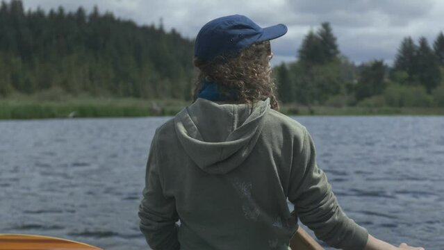 Back of a person on a canoe in Beaver Creek, Brian Booth State Park, Oregon coast