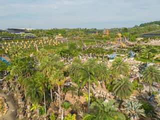 Fototapeta na wymiar Aerial top view of green trees in Nong Nooch Tropical Garden Park. Green eco area in smart urban city at noon, Pattaya, Thailand. Environment nature landscape background.
