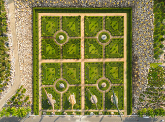 Aerial top view of green trees in Nong Nooch Tropical Garden Park. Green eco area in smart urban city at noon, Pattaya, Thailand. Environment nature landscape background.