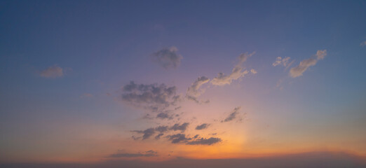 Sunset sky. Abstract nature background. Dramatic blue with orange colorful clouds in twilight time.