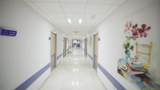 POV doctor nurse walking fast in hospital ward during an emergency 