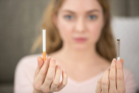 woman with two types of cigarettes