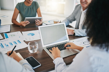 Laptop, teamwork and business people with documents in meeting. Mockup, planning and collaboration of group with statistics, analytics and graphs for sales targets, advertising or marketing strategy.