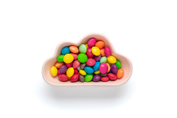 colorful candies - lollipops, meringues, macaroon in bowl in shape of cloud isolated on white background Flat lay Top View Knolling Unhealthy and tasty food creative concept Holiday card