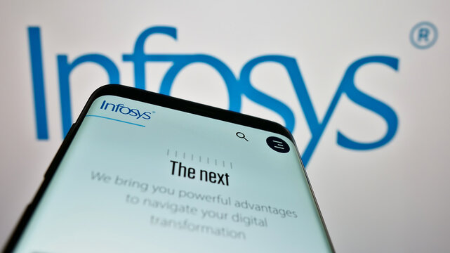 Stuttgart, Germany - 12-23-2022: Mobile phone with website of Indian IT company Infosys Limited on screen in front of business logo. Focus on top-left of phone display.