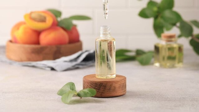 Cosmetics, oil with apricot seed extract are dripped into a dropper. Skin care.