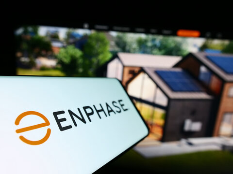 Stuttgart, Germany - 12-23-2022: Smartphone with logo of American company company Enphase Energy Inc. on screen in front of business website. Focus on left of phone display.