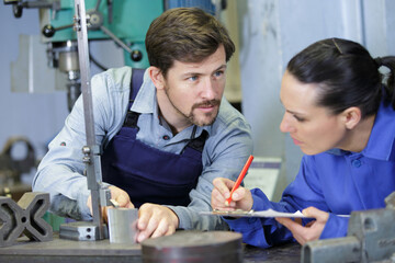 man and woman working in factory