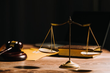 Business and lawyers discussing contract papers with brass scale on desk in office. Law, legal services, advice, justice and law concept picture with film grain effect