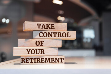 Wooden blocks with words 'Take control of your retirement'.