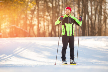 Athlete skier happy man finishes cross country skiing winter stadium