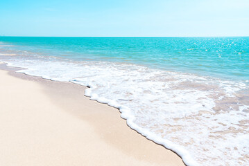 Fototapeta na wymiar Beach and blue sea on a clear day