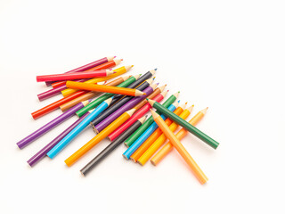 Pile of multicolored pencils on white background