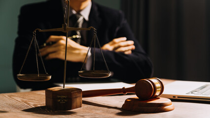 Business and lawyers discussing contract papers with brass scale on desk in office. Law, legal...